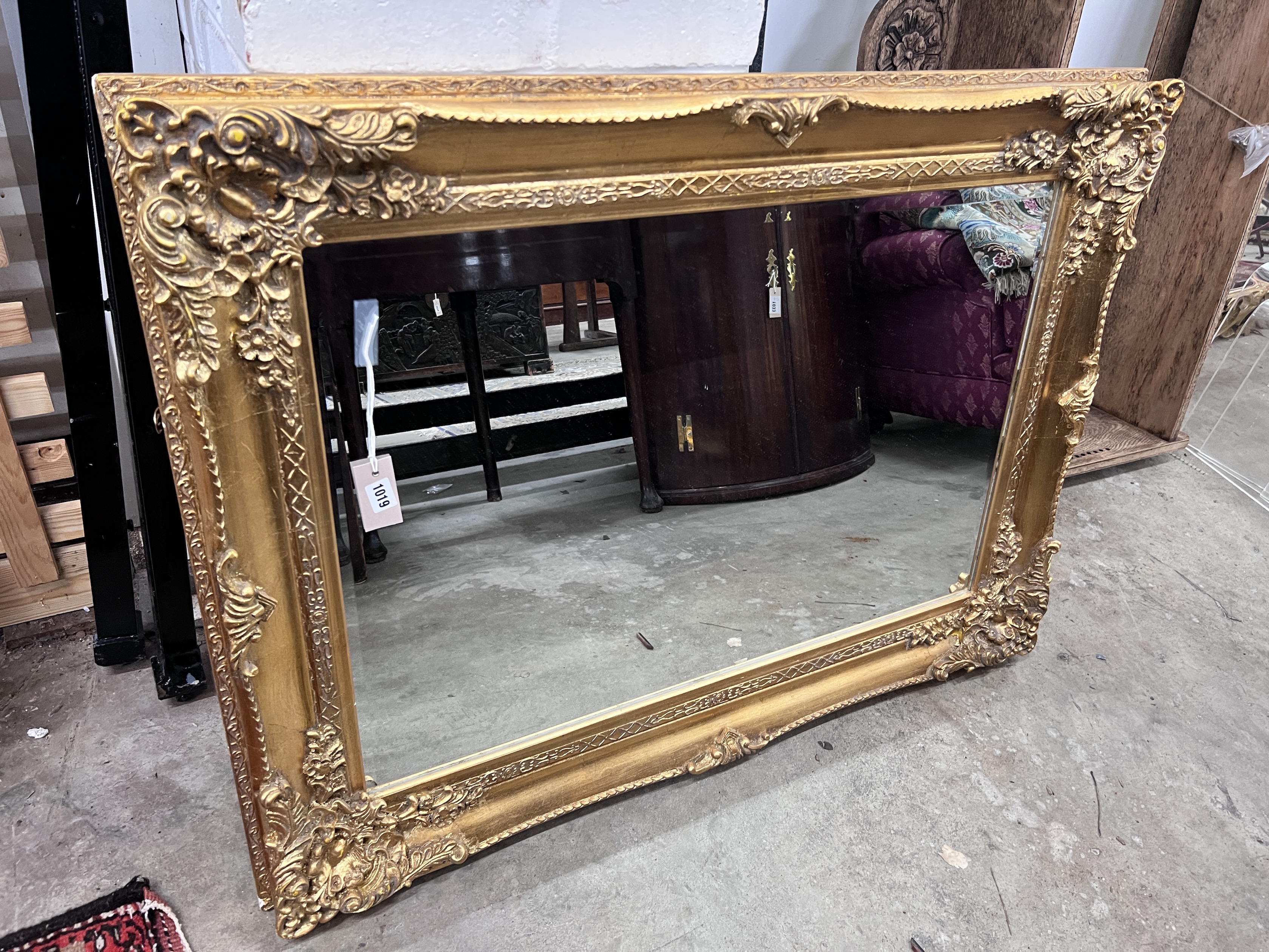 A Victorian style rectangular gilt framed wall mirror, width 113cm, height 82cm